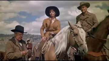 Backdrop to the movie "Guns of the Timberland" #1872738