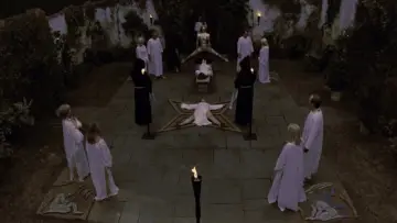 Backdrop to the movie "To the Devil a Daughter" #1095908